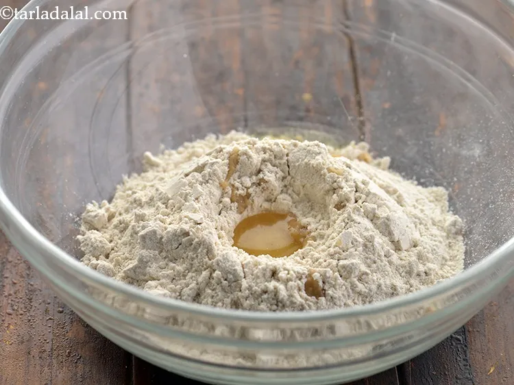 Step 9 – Prepare a well in the center and add oil.