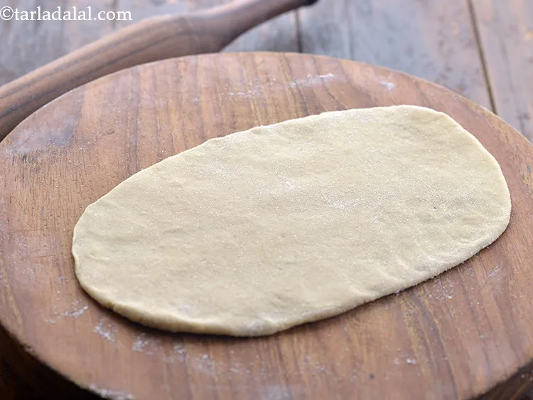 Step 17 – Roll out a portion into an oblong of 175 mm. (7&rdquo;) length and 6 mm. …