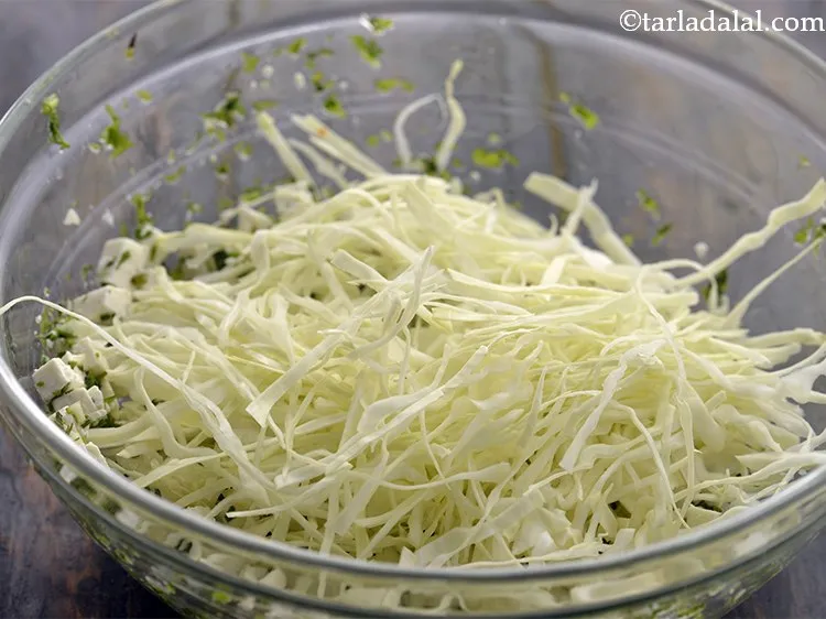 Step 34 – After 10 minutes, add shredded cabbage.