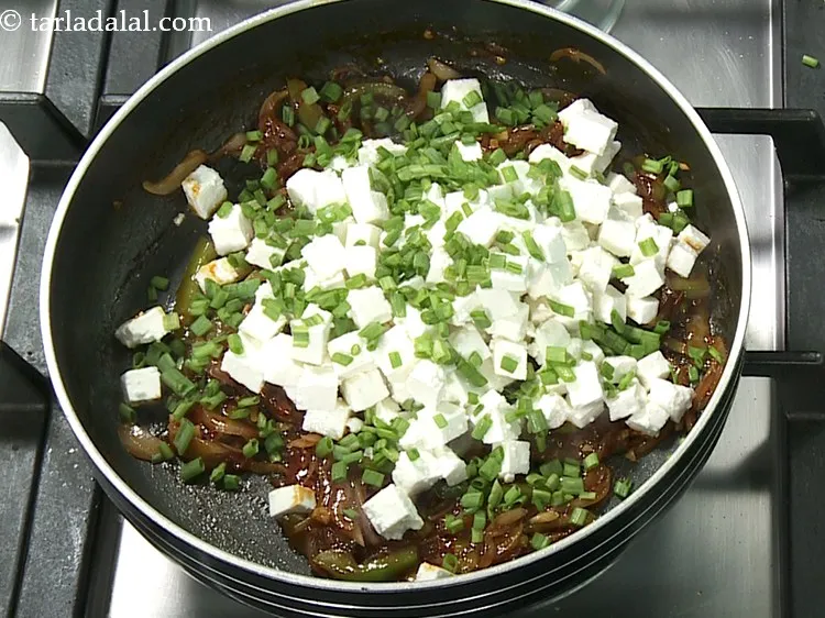 Step 13 – Add spring onion greens.