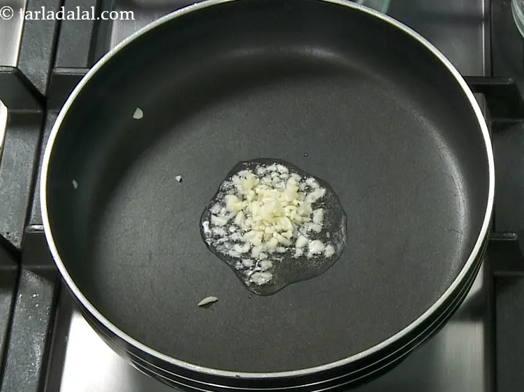 Step 2 – Once the oil is hot, add the garlic.