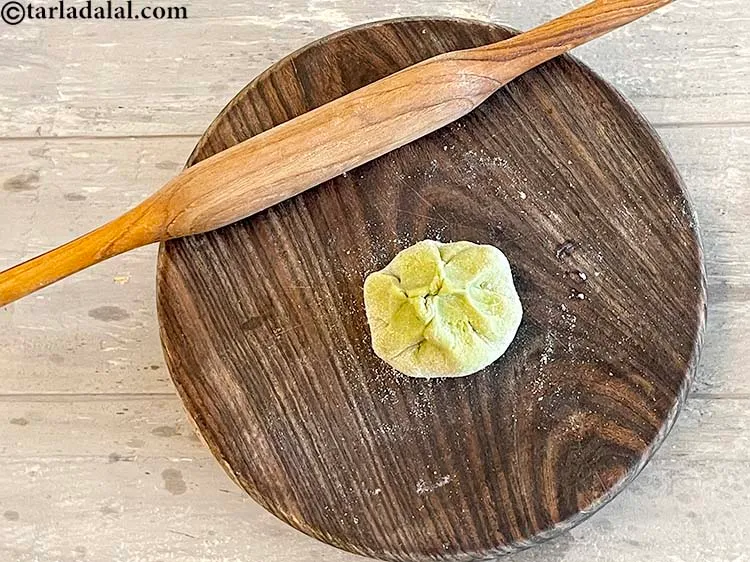 Step 30 – Bring the other 2 sides to the centre forming a shape of a money bag.