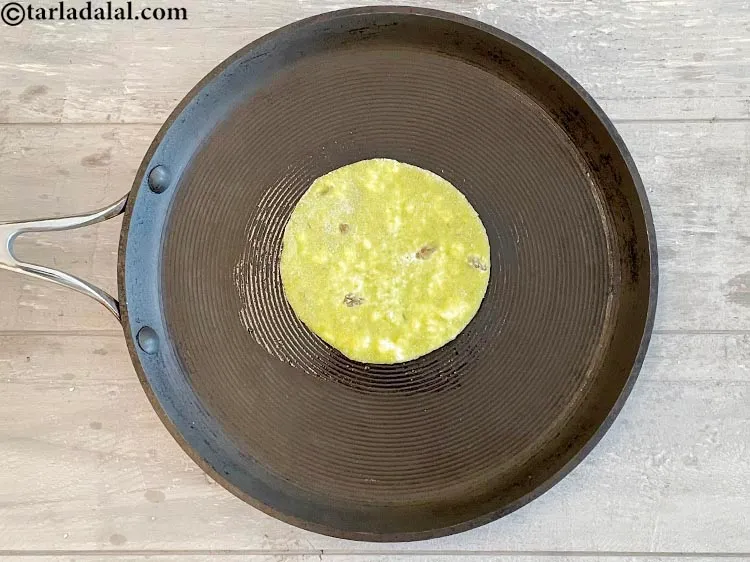 Step 34 – Cook the paratha on one side.