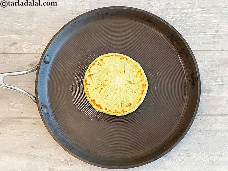 Step 35 – Grease the top side of the paratha and flip over and cook.