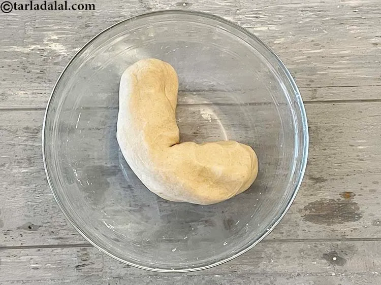 Step 11 – Roll the dough into a rope shape. Makes it easy to break it into equal …