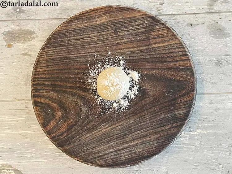 Step 21 – <meta charset="UTF-8" /> Dust a rolling board with some flour and place the dough on …