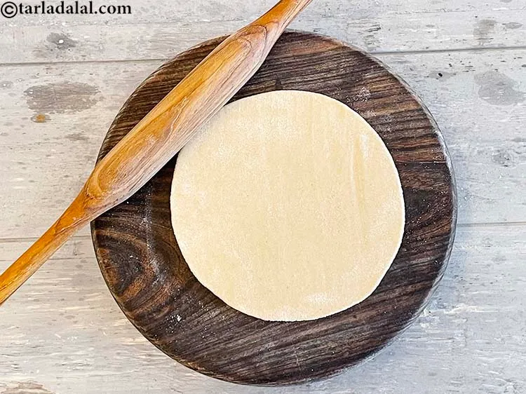 Step 23 – <meta charset="UTF-8" />Roll a portion of the dough into a 150 mm. (6&rdquo;) diameter circle …