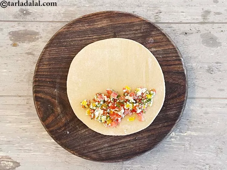 Step 24 – Spread a portion of the stuffing on half of the circle.