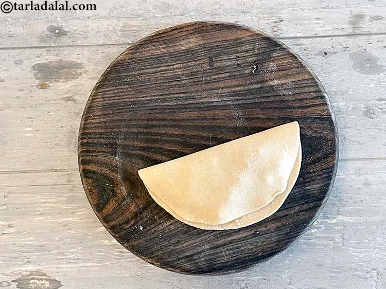 Step 25 – Fold it over to make a semi-circle.