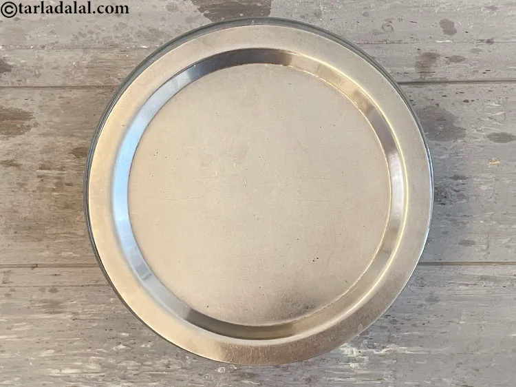 Step 7 – Cover the dough with a lid and keep aside for 15 minutes.