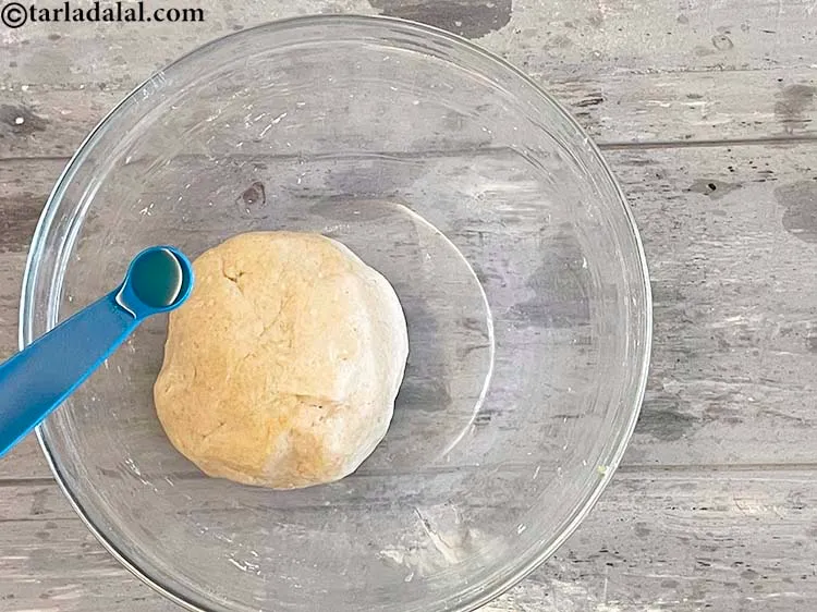 Step 9 – <meta charset="UTF-8" /> Knead again using &frac14; tsp oil till smooth.