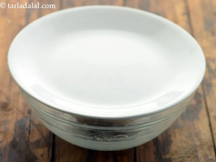 Step 7 – Cover the dough of <strong>healthy vegetable paneer paratha for kids </strong>with a lid and keep …