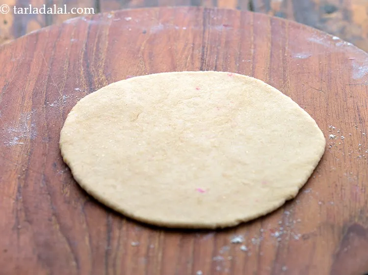 Step 16 – Roll out a portion of the dough into a 125 mm. (5&quot;) diameter circle, using …