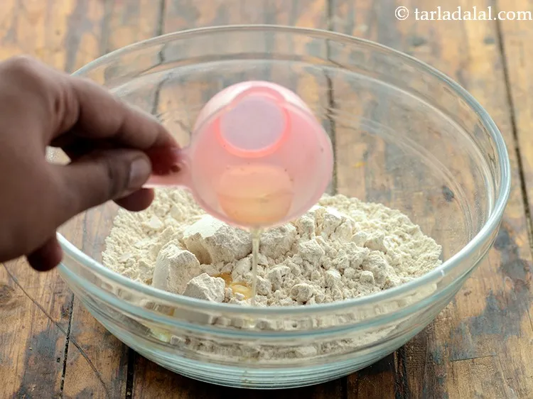 Step 2 – Add &frac12; tsp of oil to this. Adding oil makes the rotis soft.