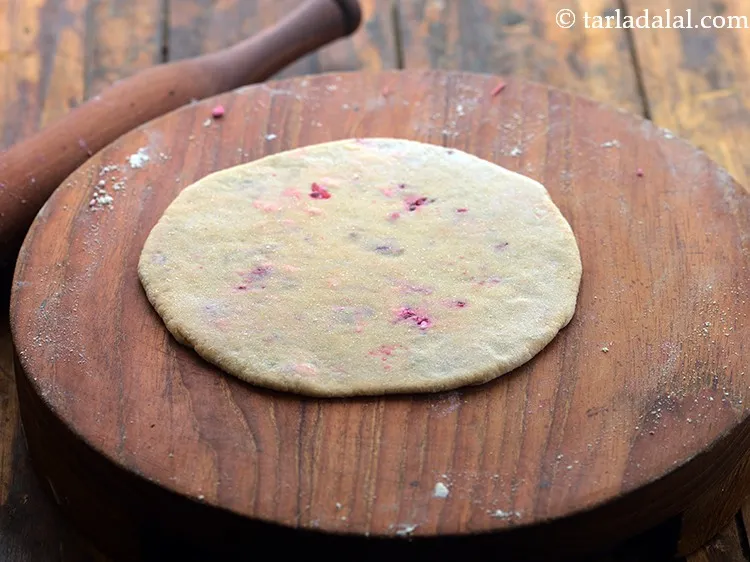 Step 19 – Again roll out into a circle of 150 mm. (6&rdquo;) diameter, using a little whole …