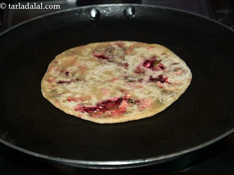 Step 20 – Heat a non-stick tava (griddle) and place the <strong>mixed vegetable paneer paratha for kids</strong> on …
