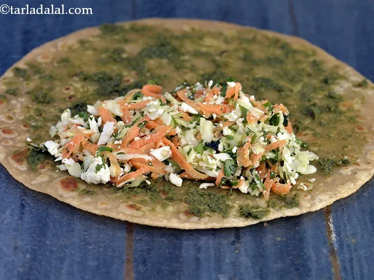 Step 29 – Put a portion of the filling at one end of the chapati.