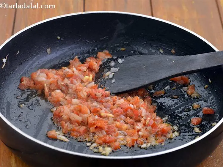 Step 4 – Add the tomatoes, mix well and cook on a medium flame for 2 minutes, while …