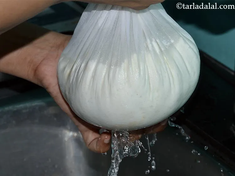 Step 18 – Wash it under running water. It is very important to wash the curdled milk properly …