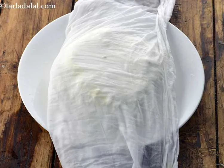 Step 22 – Give a proper shape to the paneer with your hand.