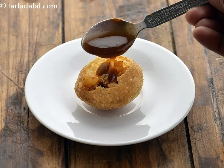 Step 31 – Top it with a little meetha chutney.