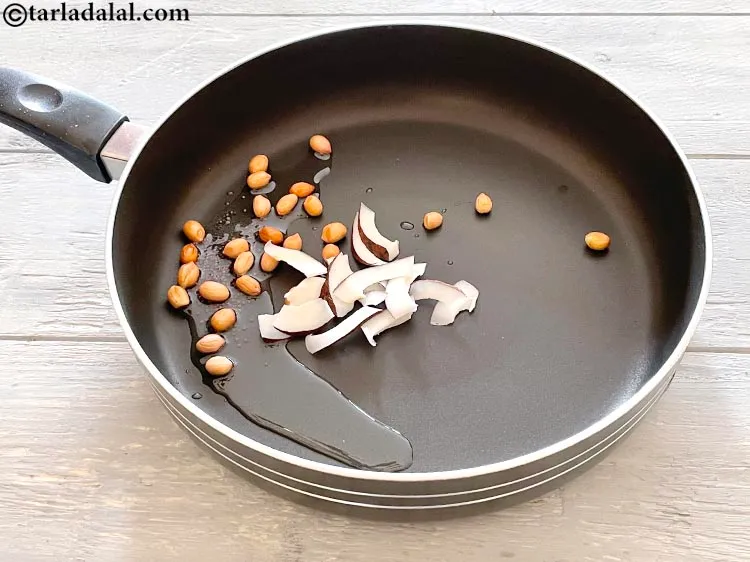 स्टेप 11 – &nbsp;<a href=""https://www.tarladalal.com/glossary-dry-coconut-kopra-hindi-270i"">सूखा नारियल</a>&nbsp;<span style=""font-size:11.0pt""><span style=""background-color:white""><span style=""font-family:"Nirmala UI",sans-serif""><span style=""color:black"">डालें।</span></span></span></span>