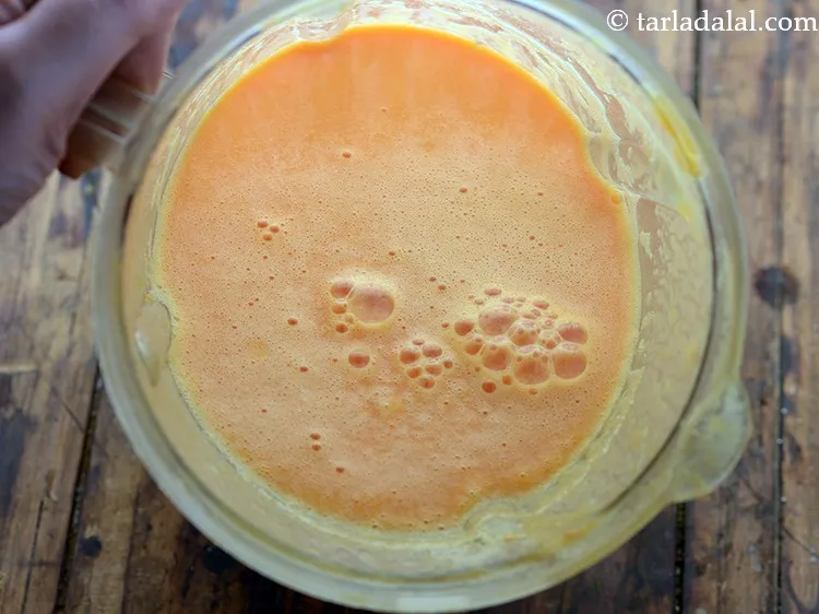 Step 12 – This is how <strong>orange papaya coconut drink</strong> looks like after blending.