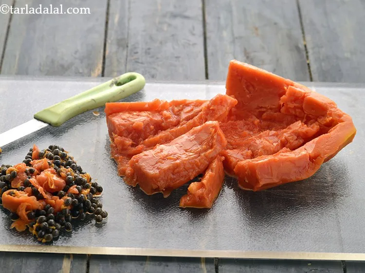 Step 5 – <strong>Deseed the papaya. </strong>Scoop out all the seeds of the papaya with a spoon. You …