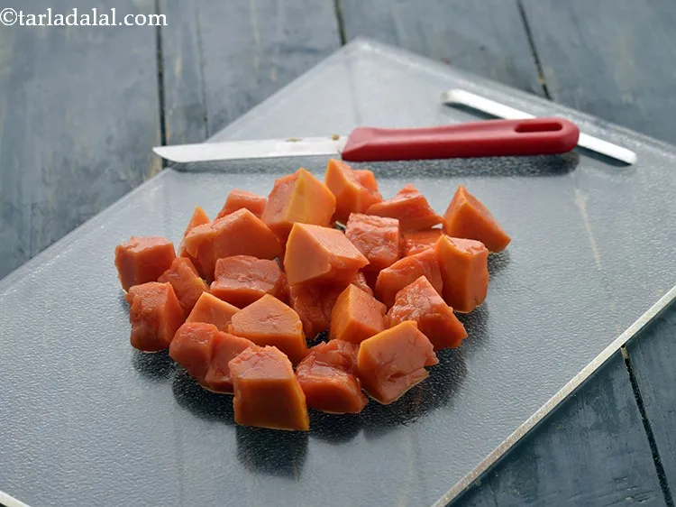 Step 6 – <strong>Chop the papaya</strong>. Chop the papaya into cubes or roughly chop it using a sharp …