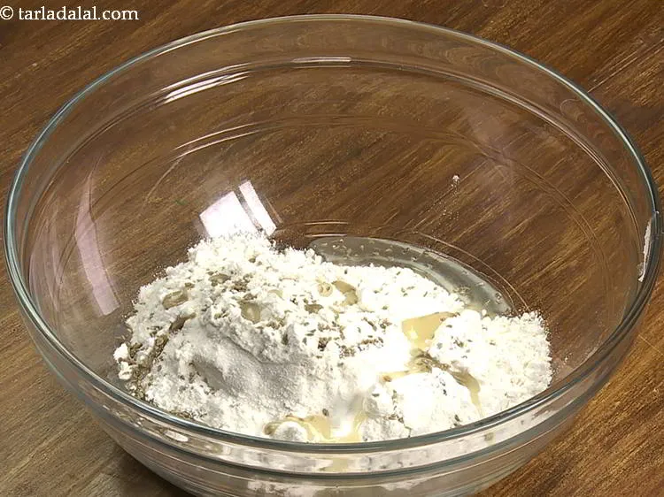 Step 15 – Add the oil. Ghee/Olive oil can also be added as Moyan for the Papadi recipe. …