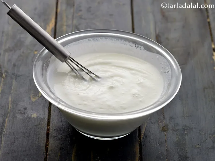 Step 11 – We will be using homemade thick curd, just whisk it using a wired whisk to …