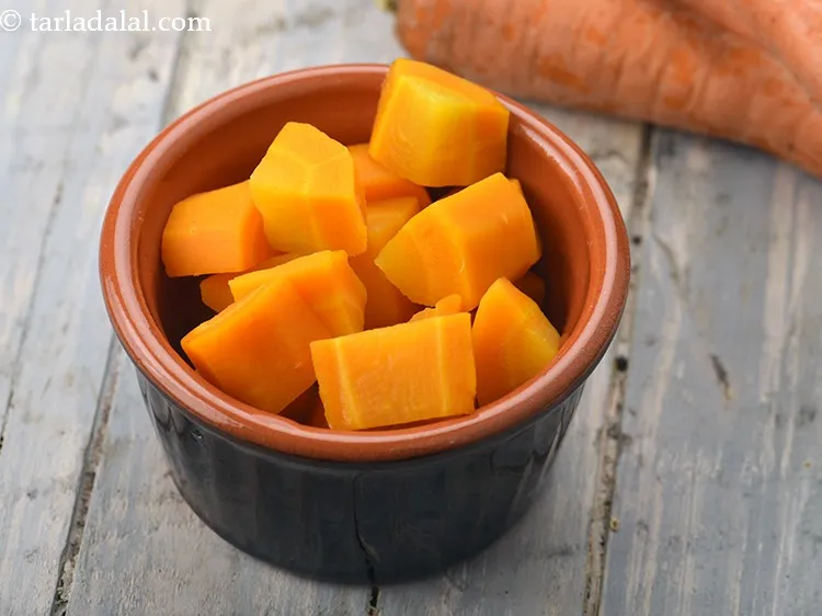 Step 22 – Add&nbsp;1/2 cup&nbsp;<a href="https://www.tarladalal.com/glossary-parboiled-carrot-cubes-2529i">blanched carrot cubes</a>.&nbsp;<a href="https://www.tarladalal.com/recipes-using-carrot-253">Carrots</a>&nbsp;have the nutrient Beta Carotene which is a form of&nbsp;<a …
