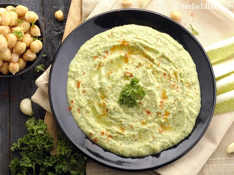 Step 19 – Spoon the <strong>parsley hummus</strong> into a serving bowl. Alternatively keep refrigerated till serving