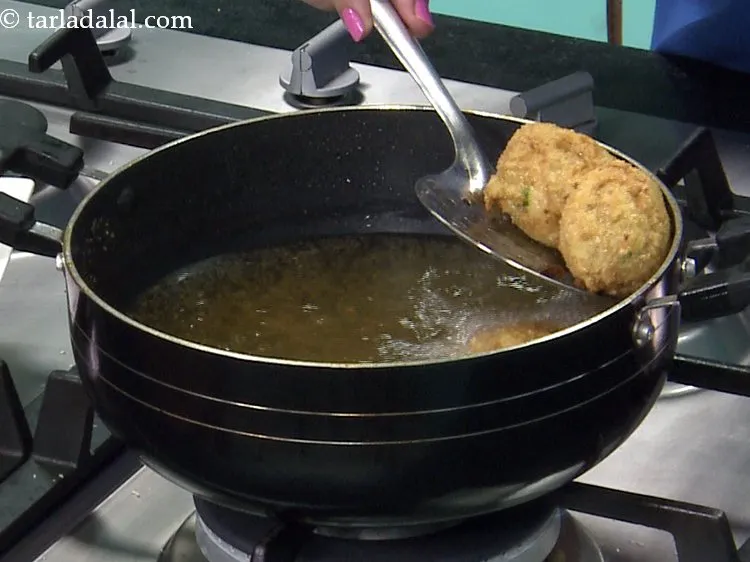 Step 21 – Deep-fry a few balls at a time on a medium flame, till they turn golden …