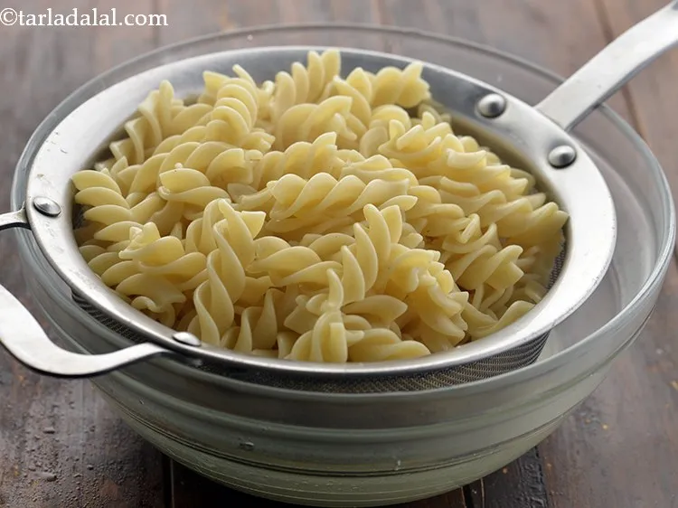 Step 7 – Immediately drain the cooked pasta into a sieve or colander.