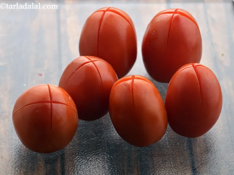 Step 14 – Make a criss-cross cut at the base of each tomato. The &ldquo;X&rdquo; cuts helps in …