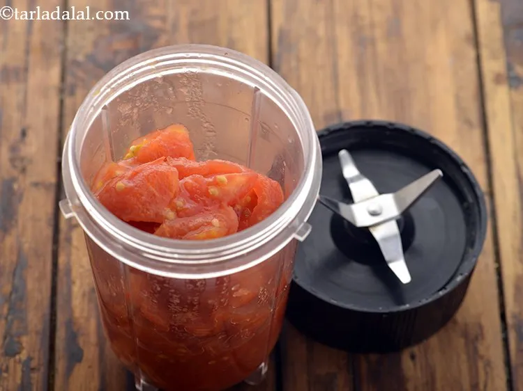 Step 18 – Transfer the chopped tomatoes to a mixer jar.