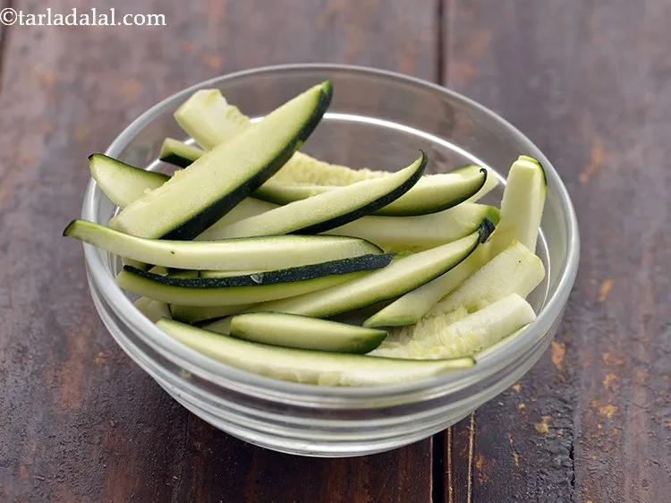 Step 14 – Without peeling, slice the zucchini and keep aside.