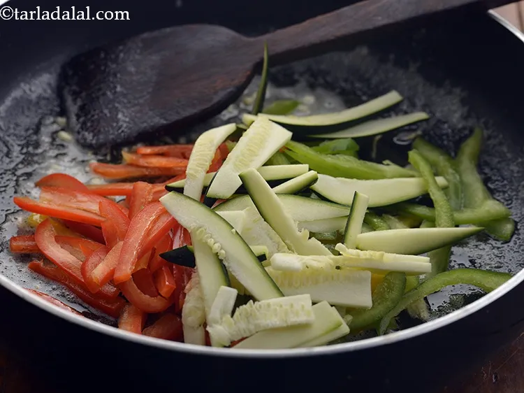 Step 25 – Add the zucchini. Also, you can make use of yellow squash.