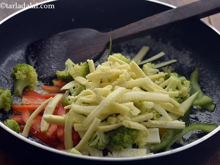Step 27 – Add the baby corn.