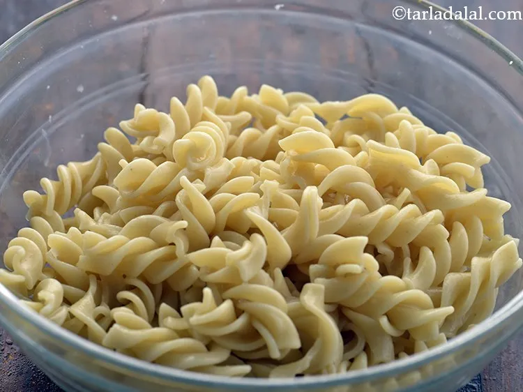 Step 12 – Drain again and keep aside.&nbsp;If the pasta is not to be used immediately, add 1 …