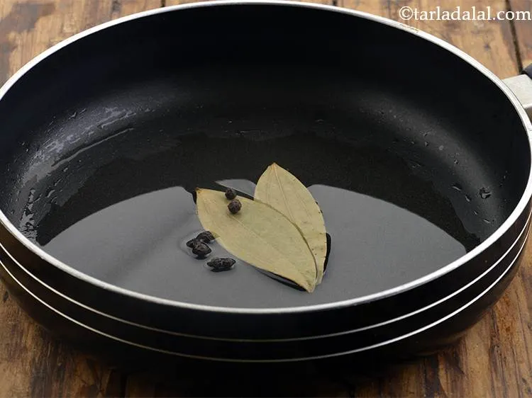 Step 24 – Then add the peppercorns and saut&eacute; on a medium flame for 30 seconds.