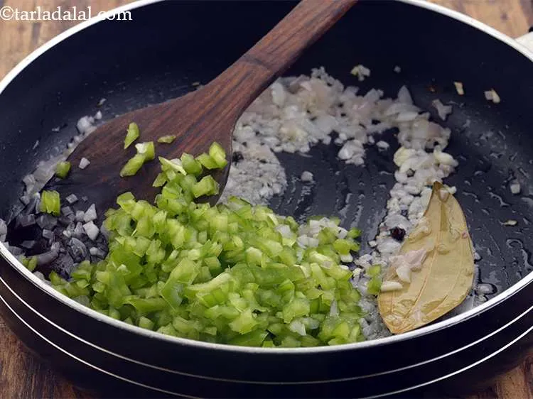 Step 28 – Add the capsicum for a crunch. You can add different colored capsicums here.