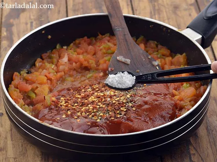 Step 37 – Also, add the sugar, mix well and cook on a medium flame for 1 minute.