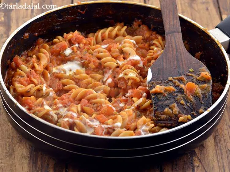 Step 42 – Garnish&nbsp;<strong>Red Sauce Pasta&nbsp;</strong>with fresh cream.