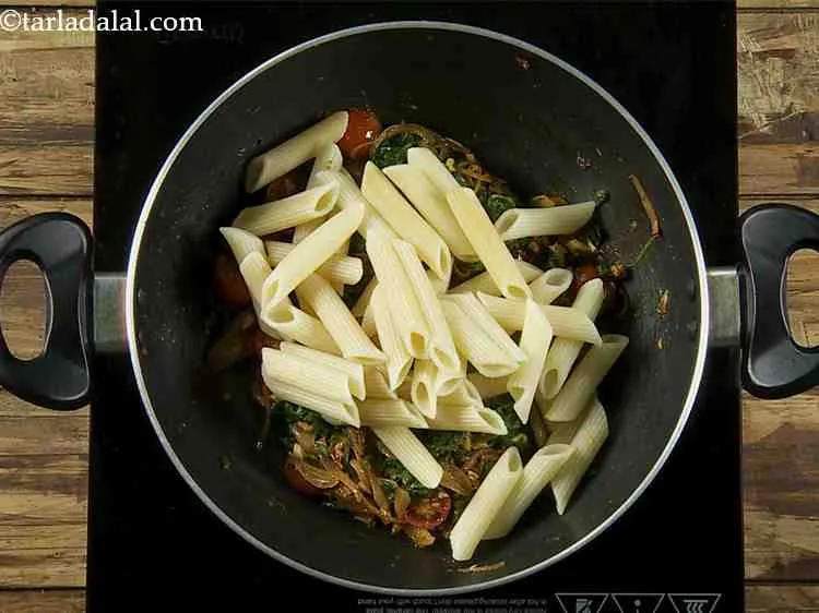 Step 10 – Once the veggies are cooked, add the boiled pasta to the pan. You can use …