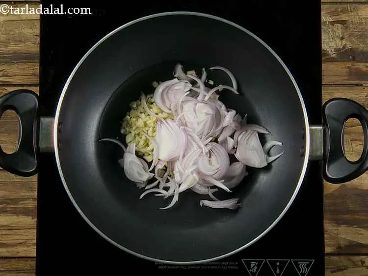 Step 3 – Now add the sliced onions to the pan.
