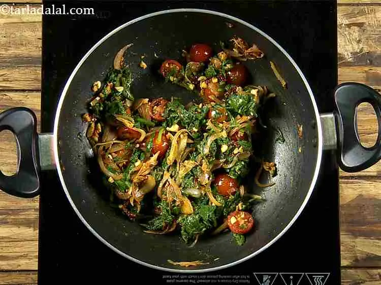 Step 9 – Now add the cherry tomato halves, mix well and cook on a medium flame for …