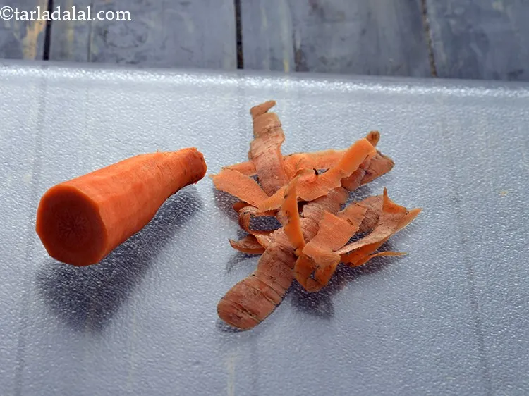 Step 5 – Peel a carrot and discard the skin.