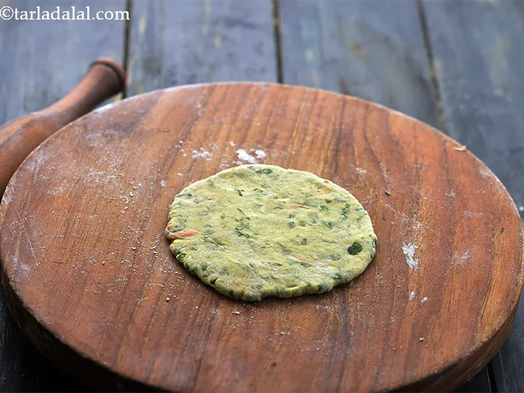 Step 18 – Roll out each portion into a 100 mm. (4&rdquo;) diameter thick circle using a little …